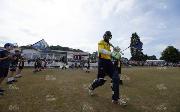 220726 - Glamorgan v Sussex Sharks, Metro Bank One Day Cup - Eddie Byrom of Glamorgan, along with Callum Nicholls of Glamorgan head out for the start of play