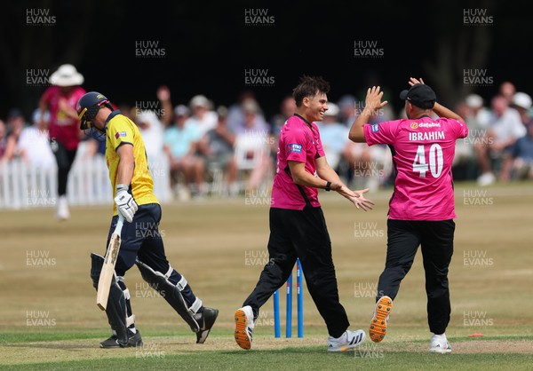 220726 - Glamorgan v Sussex Sharks, Metro Bank One Day Cup - Toby Munt of Sussex celebrates as he dismisses Henry Hurle of Glamorgan