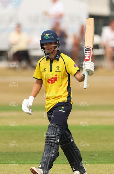 220726 - Glamorgan v Sussex Sharks, Metro Bank One Day Cup - Jack Hope-Bell of Glamorgan raises his bat as he reaches his 50 runs