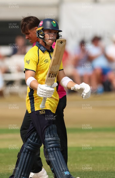 220726 - Glamorgan v Sussex Sharks, Metro Bank One Day Cup - Alex Horton of Glamorgan  raises his bat as he reaches his 50 runs
