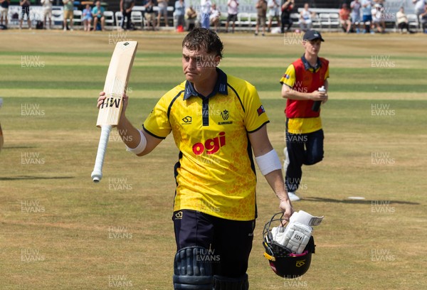 220726 - Glamorgan v Sussex Sharks, Metro Bank One Day Cup - Alex Horton of Glamorgan leaves the pitch after being dismissed on 122