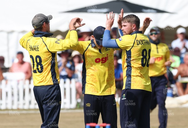 220726 - Glamorgan v Sussex Sharks, Metro Bank One Day Cup - Dan Douthwaite of Glamorgan celebrates after taking the wicket of Dan Ibrahim of Sussex