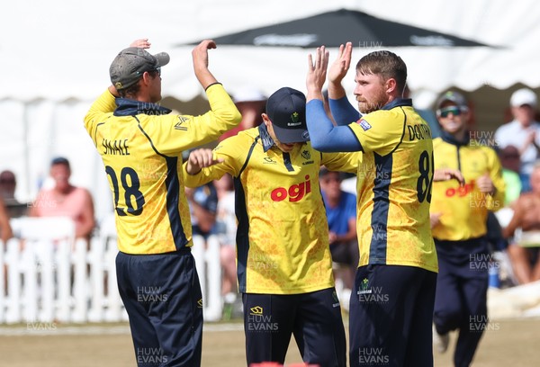 220726 - Glamorgan v Sussex Sharks, Metro Bank One Day Cup - Dan Douthwaite of Glamorgan celebrates after taking the wicket of Dan Ibrahim of Sussex
