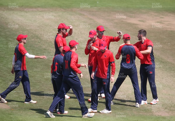 200721 - Glamorgan v Wales National County, 50 over Friendly - WNC players celebrate taking the wicket of Tom Cullen of Glamorgan