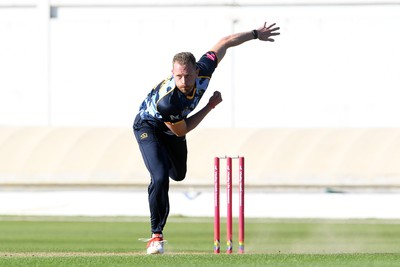 030726 - Glamorgan v Warwickshire Bears - Vitality Blast Men - Nathan McAndrew of Glamorgan bowls the ball to dismiss Zen Malik of Warwickshire Bears