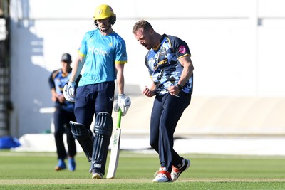 030726 - Glamorgan v Warwickshire Bears - Vitality Blast Men - Nathan McAndrew of Glamorgan bowls the ball to dismiss Zen Malik of Warwickshire Bears