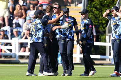 030726 - Glamorgan v Warwickshire Bears - Vitality Blast Men - Will Smale of Glamorgan celebrates with team mates after he catches the ball to dismiss Rob Yates of Warwickshire Bears