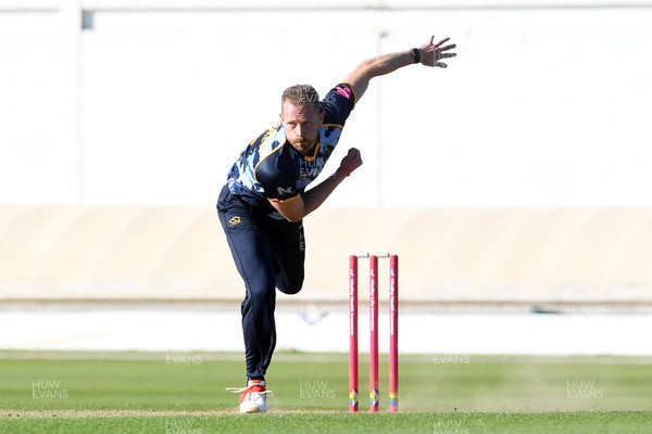 030726 - Glamorgan v Warwickshire Bears - Vitality Blast Men - Nathan McAndrew of Glamorgan bowls the ball to dismiss Zen Malik of Warwickshire Bears