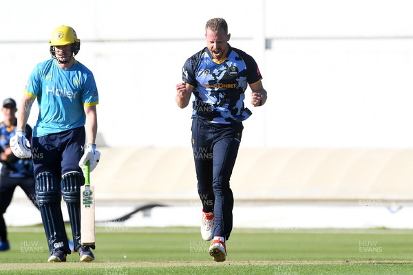 030726 - Glamorgan v Warwickshire Bears - Vitality Blast Men - Nathan McAndrew of Glamorgan bowls the ball to dismiss Zen Malik of Warwickshire Bears