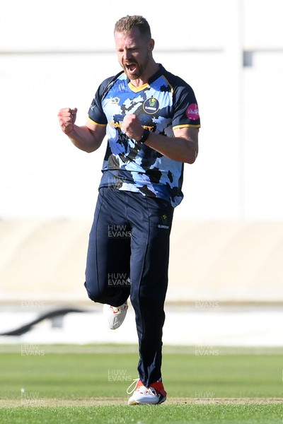030726 - Glamorgan v Warwickshire Bears - Vitality Blast Men - Nathan McAndrew of Glamorgan bowls the ball to dismiss Zen Malik of Warwickshire Bears