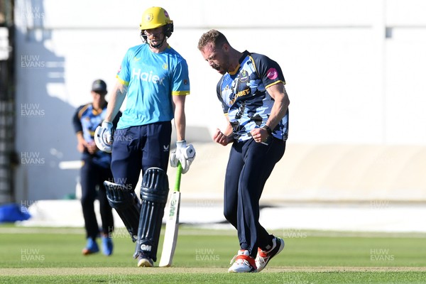 030726 - Glamorgan v Warwickshire Bears - Vitality Blast Men - Nathan McAndrew of Glamorgan bowls the ball to dismiss Zen Malik of Warwickshire Bears