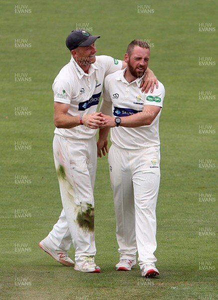 010719 - Glamorgan v Worcestershire - Specsavers County Championship Division Two - David Lloyd of Glamorgan celebrates with Graham Wagg after Joshua Dell is caught by Tom Cullen