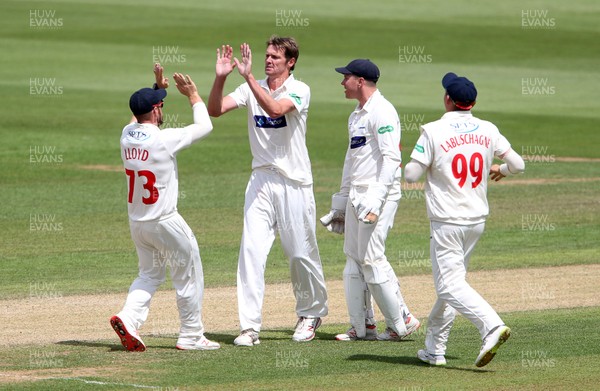 020719 - Glamorgan v Worcestershire - Specsavers County Championship Division Two - Michael Hogan of Glamorgan celebrates with team mates after bowling out Ed Barnard for LBW