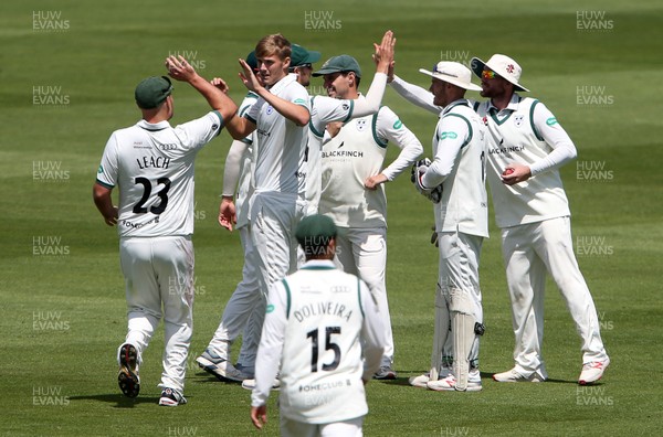 300619 - Glamorgan v Worcestershire - Specsavers County Championship Division Two - Adam Finch of Worcestershire celebrates with team mates after Owen Morgan is caught by Riki Wessels