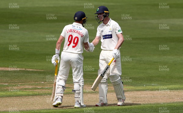 300619 - Glamorgan v Worcestershire - Specsavers County Championship Division Two - Nick Selman of Glamorgan acknowledges his half century with Marnus Labuschagne