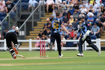 050726 - Glamorgan v Worcestershire Rapids - Vitality Blast Men - Jimmy Neesham of Glamorgan kicks the ball at the wicket in an attempt to get Matthew Waite of Worcestershire out