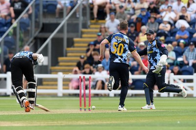 050726 - Glamorgan v Worcestershire Rapids - Vitality Blast Men - Jimmy Neesham of Glamorgan kicks the ball at the wicket in an attempt to get Matthew Waite of Worcestershire out