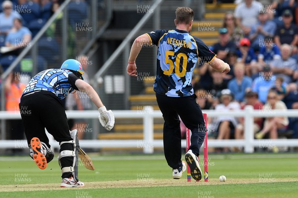 050726 - Glamorgan v Worcestershire Rapids - Vitality Blast Men - Jimmy Neesham of Glamorgan kicks the ball at the wicket in an attempt to get Matthew Waite of Worcestershire out