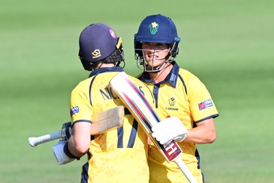 090826 - Glamorgan v Worcestershire Rapids - Metro Bank One Day Cup Men - Jack Hope-Bell of Glamorgan hits 50 and is congratulated by Callum Nicholls