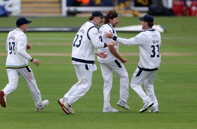 030426 - Glamorgan v Yorkshire - Rothesay County Championship Division One - Jack White of Yorkshire celebrates with team mates after Asa Tribe was caught by Jonny Bairstow