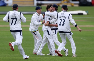 030426 - Glamorgan v Yorkshire - Rothesay County Championship Division One - Jack White of Yorkshire celebrates with team mates after Asa Tribe was caught by Jonny Bairstow