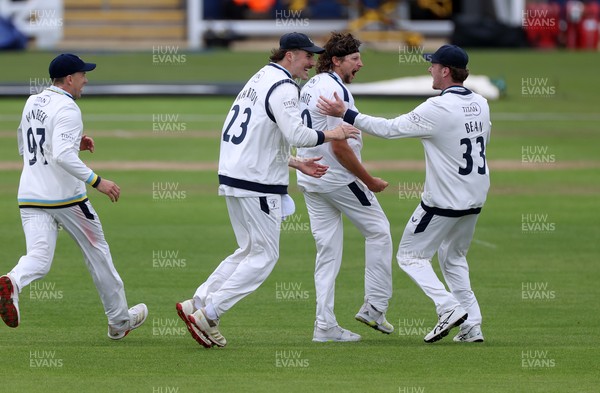 030426 - Glamorgan v Yorkshire - Rothesay County Championship Division One - Jack White of Yorkshire celebrates with team mates after Asa Tribe was caught by Jonny Bairstow