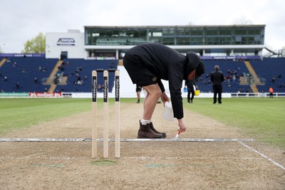 040426 - Glamorgan v Yorkshire - Rothesay County Championship Division One - Ground staff prepare the wicket at tea