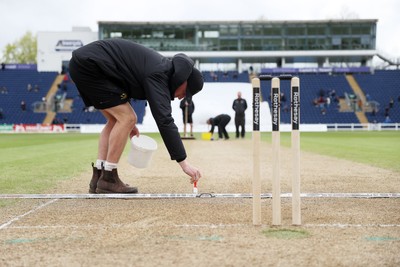 040426 - Glamorgan v Yorkshire - Rothesay County Championship Division One - Ground staff prepare the wicket at tea