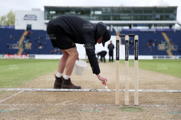 040426 - Glamorgan v Yorkshire - Rothesay County Championship Division One - Ground staff prepare the wicket at tea