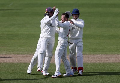 050426 - Glamorgan v Yorkshire - Rothesay County Championship Division One - Mason Crane of Glamorgan celebrates taking the wicket of George Hill of Yorkshire