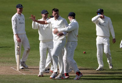 050426 - Glamorgan v Yorkshire - Rothesay County Championship Division One - Ryan Hadley of Glamorgan celebrates taking the wicket of Logan van Beek with team mates