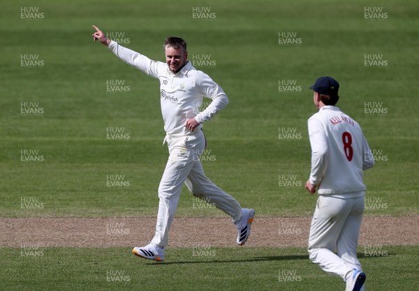 050426 - Glamorgan v Yorkshire - Rothesay County Championship Division One - Mason Crane of Glamorgan celebrates taking the wicket of George Hill of Yorkshire