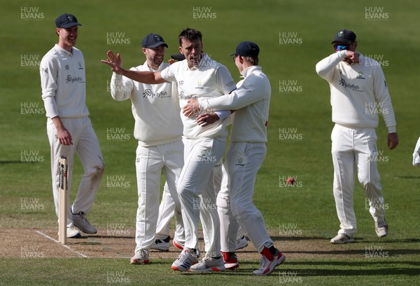 050426 - Glamorgan v Yorkshire - Rothesay County Championship Division One - Ryan Hadley of Glamorgan celebrates taking the wicket of Logan van Beek with team mates