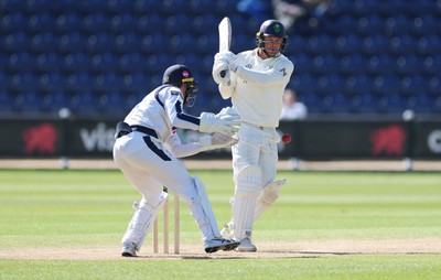 060426 - Glamorgan v Yorkshire, Rothesay County Championship, Division One - Finlay Bean of Yorkshire takes the ball as Colin Ingram of Glamorgan looks on