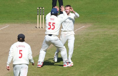 060426 - Glamorgan v Yorkshire, Rothesay County Championship, Division One - Mason Crane of Glamorgan celebrates with team mates as he takes the wicket of as Finlay Bean of Yorkshire lbw