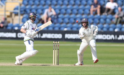 060426 - Glamorgan v Yorkshire, Rothesay County Championship, Division One - Adam Lyth of Yorkshire looks on as Chris Cooke of Glamorgan takes the ball
