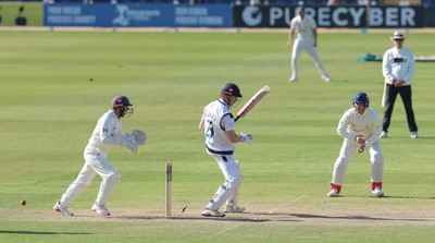 060426 - Glamorgan v Yorkshire, Rothesay County Championship, Division One - Chris Cooke of Glamorgan  celebrates as James Wharton of Yorkshire is bowled by Mason Crane of Glamorgan