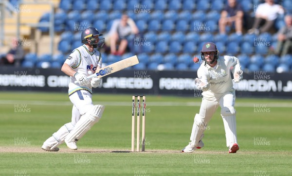 060426 - Glamorgan v Yorkshire, Rothesay County Championship, Division One - Adam Lyth of Yorkshire looks on as Chris Cooke of Glamorgan takes the ball