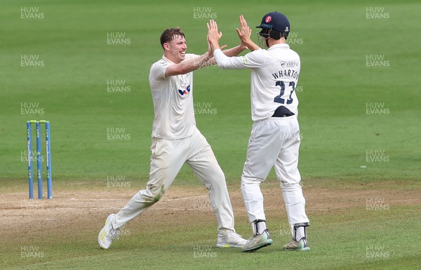 120923 - Glamorgan v Yorkshire, LV= County Championship, Division 2 - Matthew Revis of Yorkshire and James Wharton of Yorkshire celebrate after taking the wicket of Kiran Carlson of Glamorgan