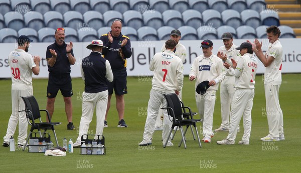 140521 - Glamorgan v Yorkshire, LV= County Championship Group Three - Billy Root of Glamorgan is presented with his Glamorgan County cap at the start of the final session of the day's play