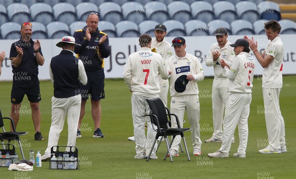 140521 - Glamorgan v Yorkshire, LV= County Championship Group Three - Billy Root of Glamorgan is presented with his Glamorgan County cap at the start of the final session of the day's play