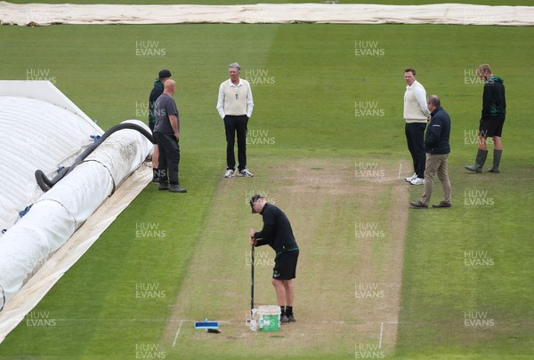 150521 - Glamorgan v Yorkshire, LV= County Championship Group Three - The umpires chat to ground staff ahead of an announcement of a start to the day's play