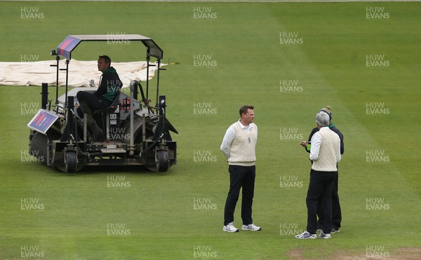 150521 - Glamorgan v Yorkshire, LV= County Championship Group Three - The umpires chat to ground staff ahead of an announcement of a start to the day's play