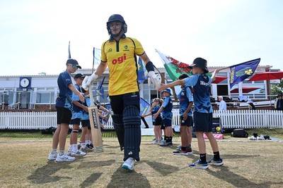 240726 - Glamorgan v Yorkshire - Metro Bank One Day Cup Men - Callum Nicholls of Glamorgan runs out at the start of the match