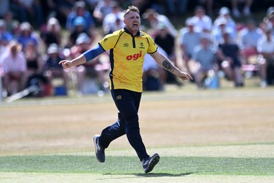 240726 - Glamorgan v Yorkshire - Metro Bank One Day Cup Men - Dan Douthwaite of Glamorgan bowls the ball to dismiss Will Bennison of Yorkshire