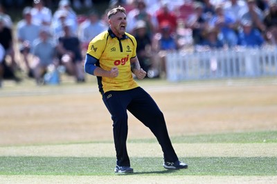 240726 - Glamorgan v Yorkshire - Metro Bank One Day Cup Men - Dan Douthwaite of Glamorgan bowls the ball to dismiss Will Bennison of Yorkshire