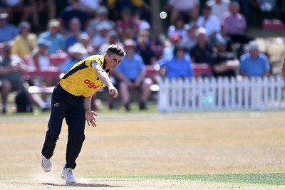 240726 - Glamorgan v Yorkshire - Metro Bank One Day Cup Men - Andy Gorvin of Glamorgan bowls the ball to dismiss George Hill of Yorkshire