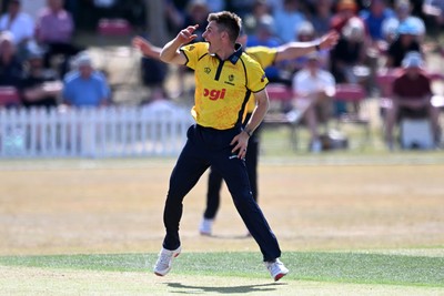 240726 - Glamorgan v Yorkshire - Metro Bank One Day Cup Men - Andy Gorvin of Glamorgan bowls the ball to dismiss George Hill of Yorkshire