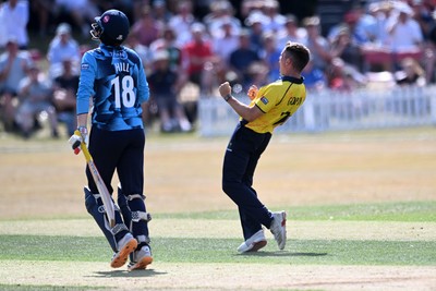 240726 - Glamorgan v Yorkshire - Metro Bank One Day Cup Men - Andy Gorvin of Glamorgan bowls the ball to dismiss George Hill of Yorkshire