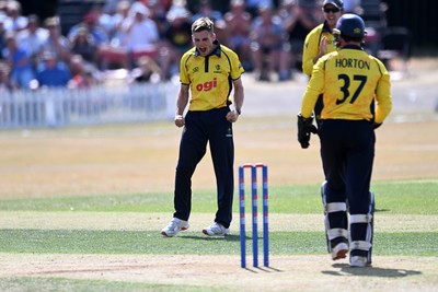 240726 - Glamorgan v Yorkshire - Metro Bank One Day Cup Men - Andy Gorvin of Glamorgan bowls the ball to dismiss George Hill of Yorkshire